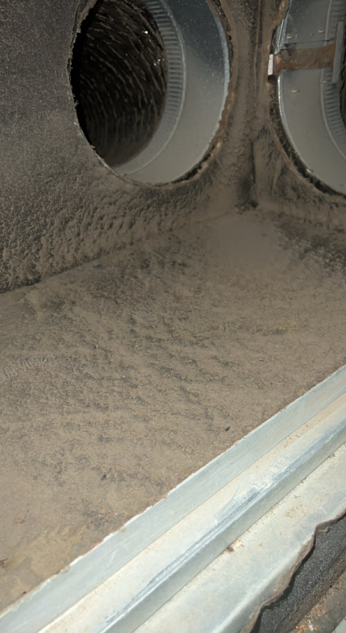 Dirty air duct openings with dust buildup before cleaning in Memphis TN