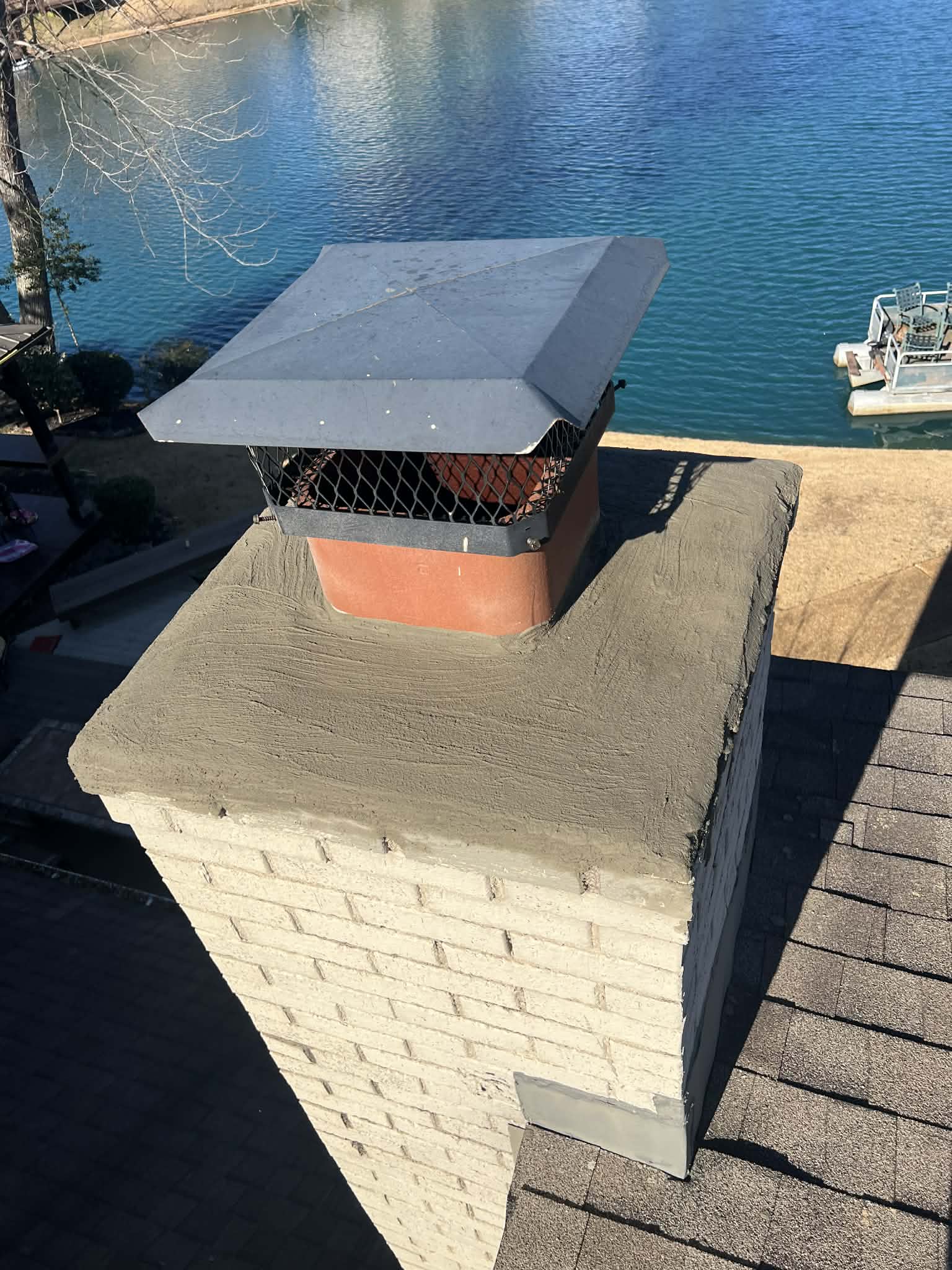 New stainless steel chimney cap installed on a Memphis-area chimney